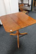 A 19th century stained pine tilt top occasional table