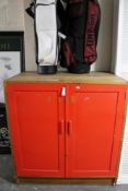 A mid 20th century painted double door cabinet