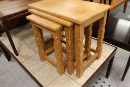 A nest of light oak tables