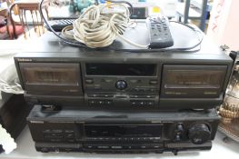 A Technics stereo cassette deck together with a stereo receiver