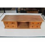 A four drawer wooden desk stand