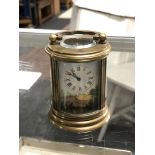 A brass enamelled French miniature carriage clock