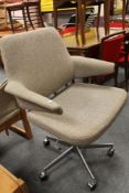 A mid century office swivel chair