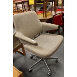 A mid century office swivel chair