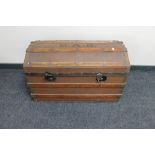 A vintage wooden bound domed trunk