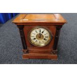 An Edwardian stained pine mantel clock