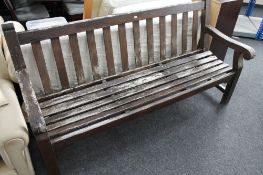 A large wooden garden bench