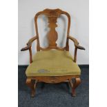 An early 20th century oak armchair