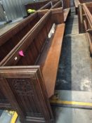 An oak two section pew, lengths 287 cm & 281 cm.