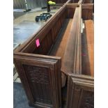 An oak two section pew, lengths 287 cm & 281 cm.