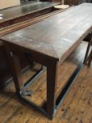 An antique oak altar table on wheels, 62 cm x 244 cm.