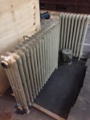 Two cast metal radiators (91 cm wide and 49 cm wide).