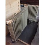 Two cast metal radiators (91 cm wide and 49 cm wide).