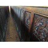 A carved oak panel, length 568 cm, height 86 cm.