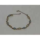 A gold and aquamarine bracelet