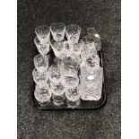 A tray of two glass decanters with stoppers, cut glass rummers,