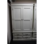 A contemporary white double door wardrobe fitted with four drawers