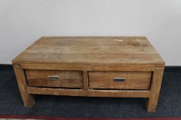 A sheesham wood two drawer low table