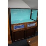 A mid century display cabinet with advertising decoration - Haberdashery