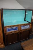 A mid century display cabinet with advertising decoration - Haberdashery