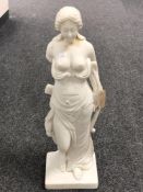 A heavy resin figure of a semi-nude female, height 61 cm.