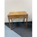 An oak side table fitted with a drawer