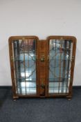 A walnut display cabinet with chinoiserie detail