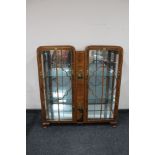 A walnut display cabinet with chinoiserie detail