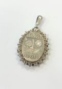 An ornate antique silver locket CONDITION REPORT: In good condition. Clasp working.