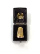 A Victorian gold thimble in box, 6g.