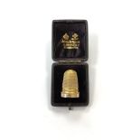 A Victorian gold thimble in box, 6g.