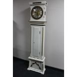 A reproduction painted dial longcased clock