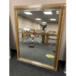 A golden framed mirror