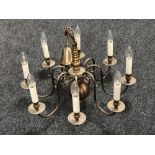 A Continental eight branch metal chandelier