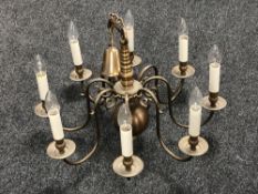 A Continental eight branch metal chandelier