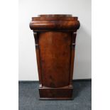 A mahogany pedestal cabinet