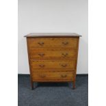 An Edwardian inlaid mahogany four drawer chest