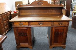 A continental oak double pedestal desk
