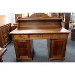 A continental oak double pedestal desk