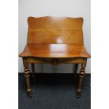 A nineteenth century walnut tea table