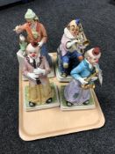 Four musical pottery clown figures