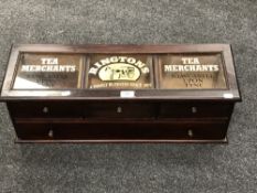 A glazed mahogany four drawer chest bearing 'Ringtons Tea Merchant' advertising