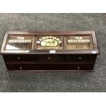 A glazed mahogany four drawer chest bearing 'Ringtons Tea Merchant' advertising