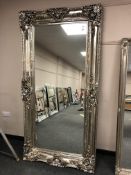 A large champagne framed mirror