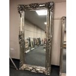 A large champagne framed mirror