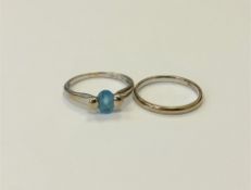 A 9ct gold blue topaz ring and a 9ct gold band ring. (2) CONDITION REPORT: 4.