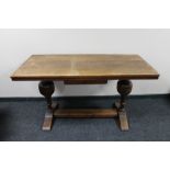 An oak refectory style dining room table on bulbous supports