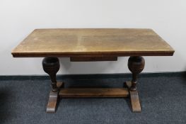 An oak refectory style dining room table on bulbous supports