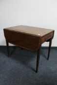 An inlaid mahogany Victorian Pembroke table CONDITION REPORT: Historic split to top