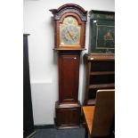 A nineteenth century mahogany longcased clock with brass and silvered dial